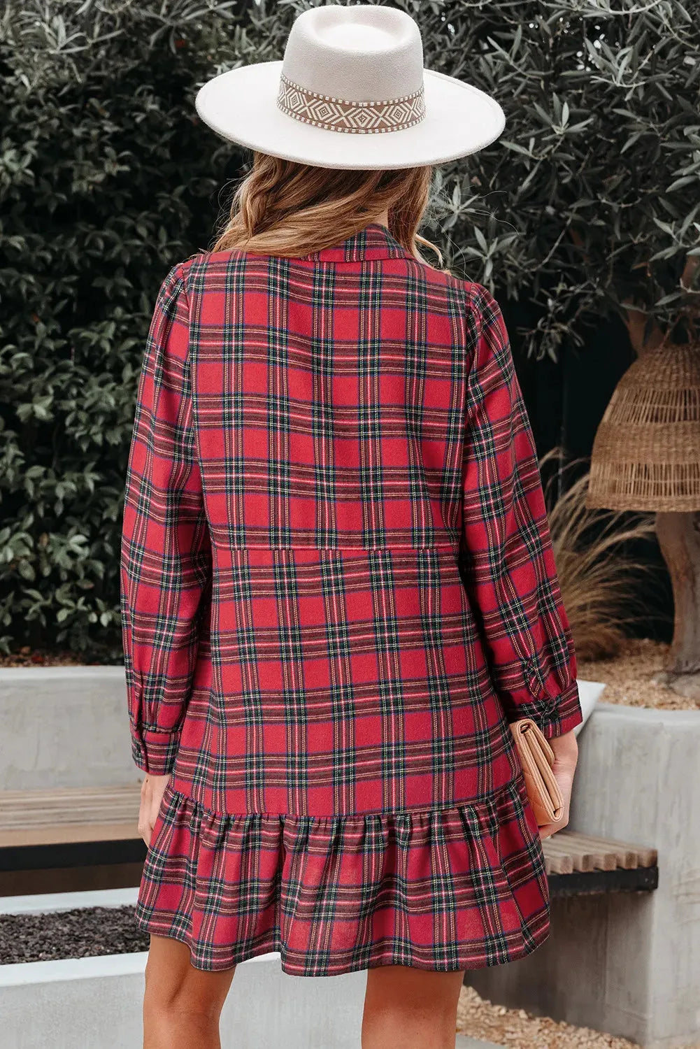 Red and white plaid women's mini dress with a shirt collar, half-button front, long sleeves, and a ruffle hem.