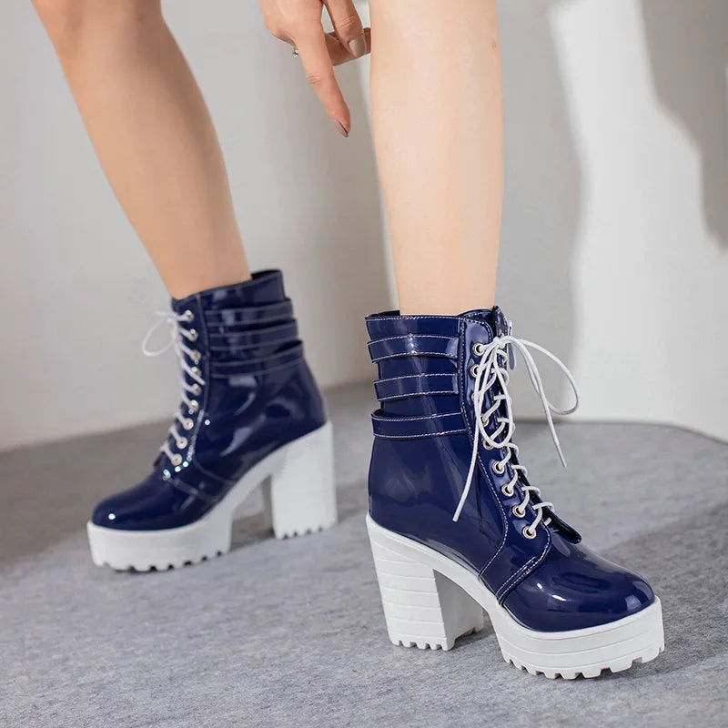 Women's black chunky heel ankle boots with lace-up front and round toe.