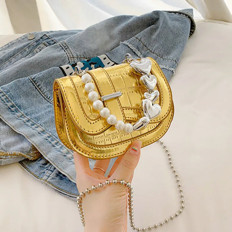 Women's silver PU mini saddle crossbody bag with phone pocket and single shoulder strap