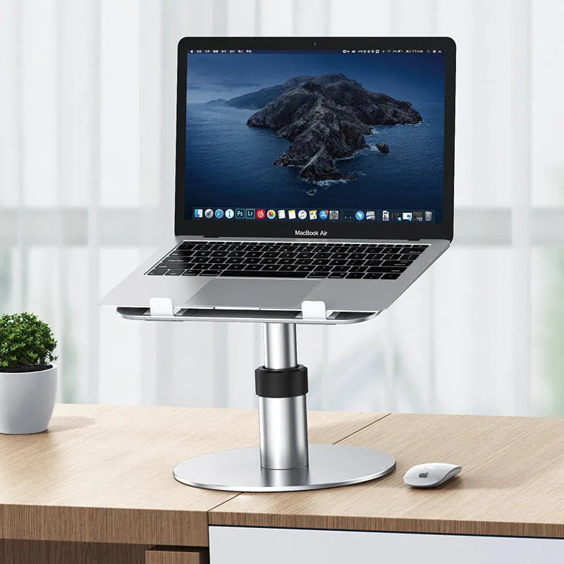 Silver adjustable aluminium car laptop stand with rotating base on a car seat.