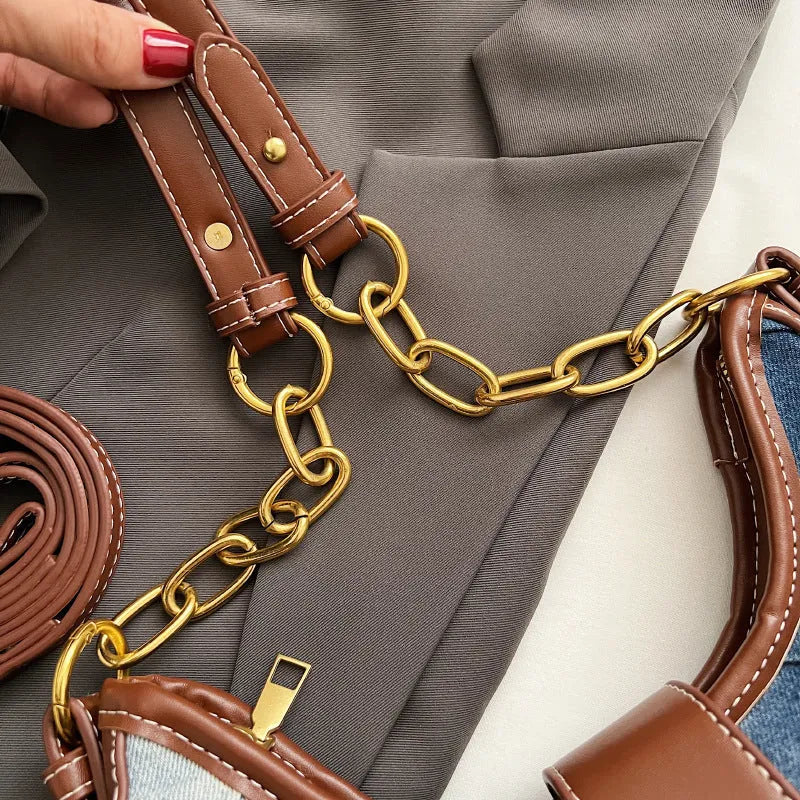 Brown denim women's bucket shoulder bag with diamond mesh, chain detail, and double straps.