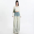 Women's gradient blue straight-leg denim trousers with wide leg fit on hanger