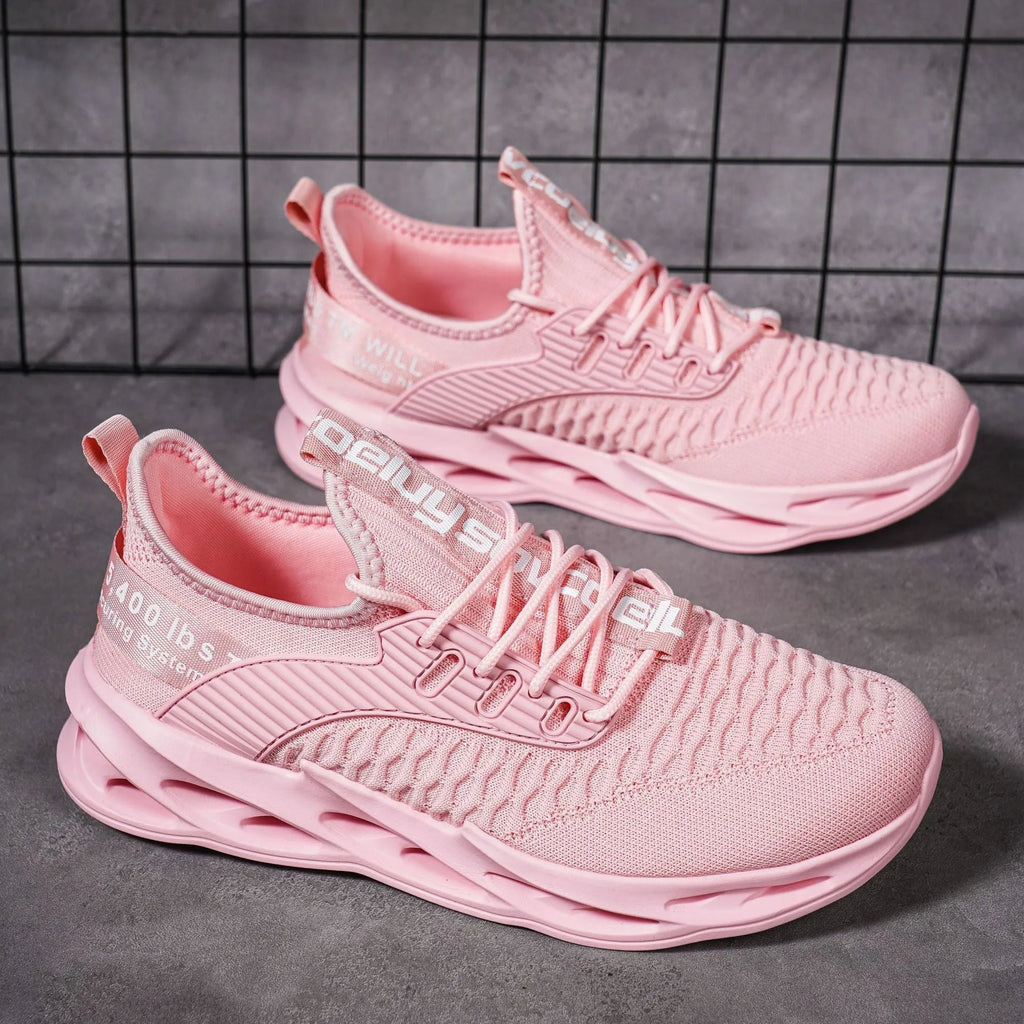 Women's FlyKnit mesh casual shoes in light pink colour showing flat heel and round toe design.