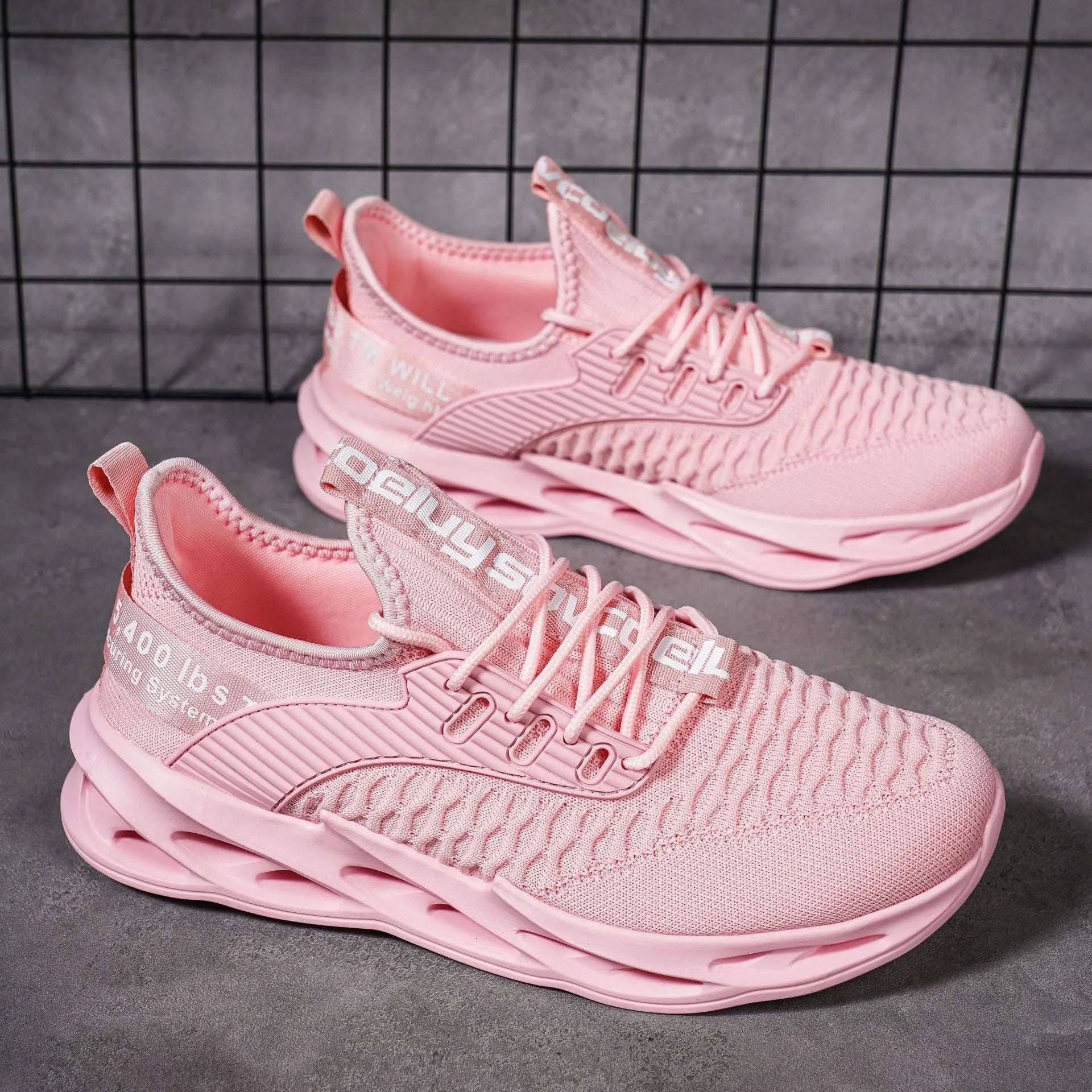 Women's FlyKnit mesh casual shoes in light pink colour showing flat heel and round toe design.