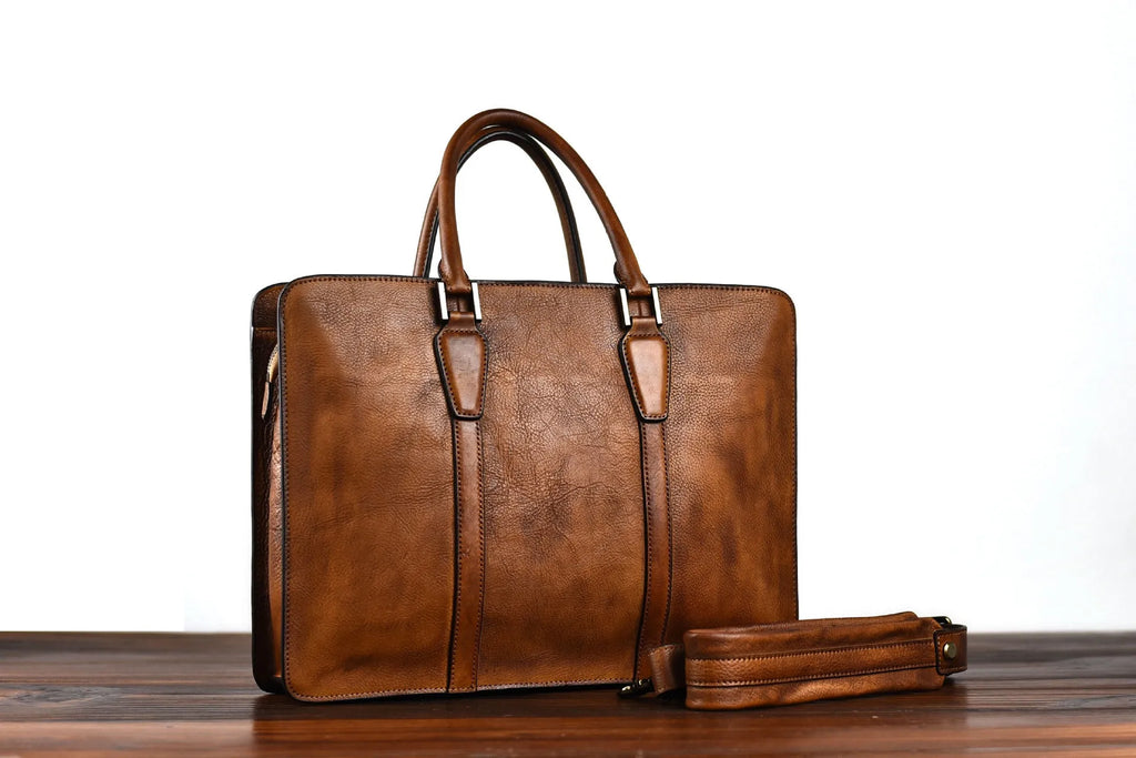 Men's brown leather retro handbag with a horizontal square shape and zipper opening