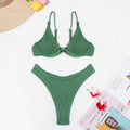 Green women's bikini swimsuit with ruffle detail and split-style briefs