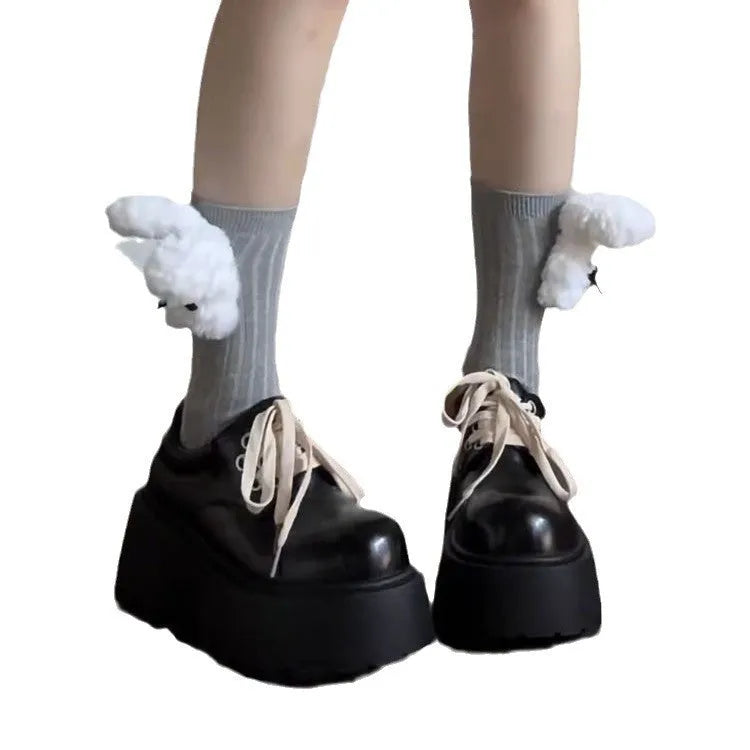Matte black women's lace-up boots with thick rubber sole and English muffin heel