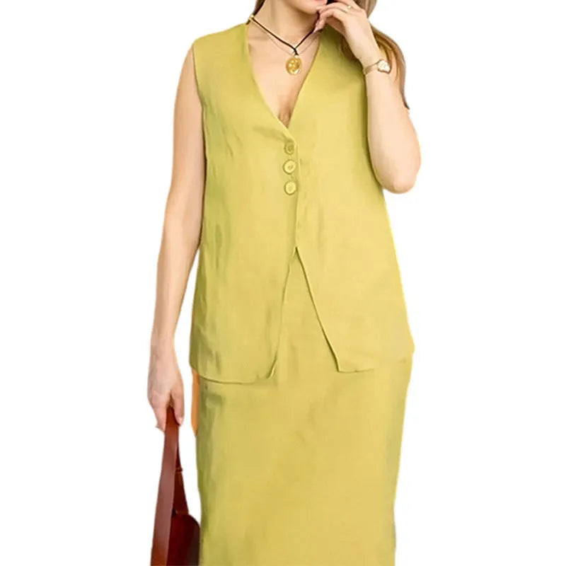 White casual women's two-piece set with sleeveless loose vest and long flowing skirt on a hanger.