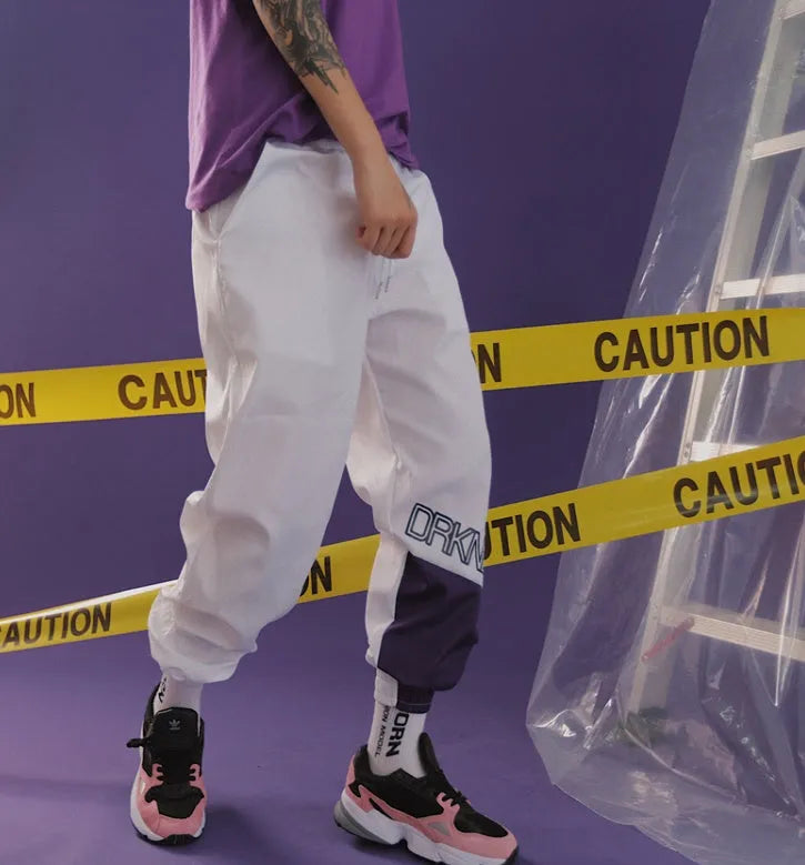 Japanese hip hop trousers with hit colour stitching, letter print, and bouquet foot detail in green low-waist drawstring style
