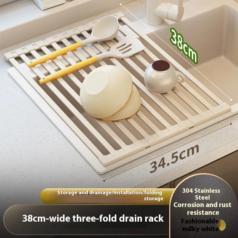 Foldable milky white stainless steel kitchen draining rack shown next to a sink.