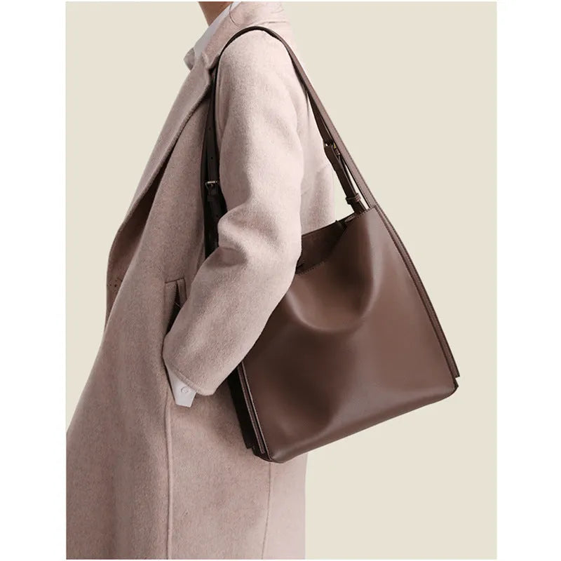 Brown genuine leather women's bucket bag with double shoulder straps and slit pocket