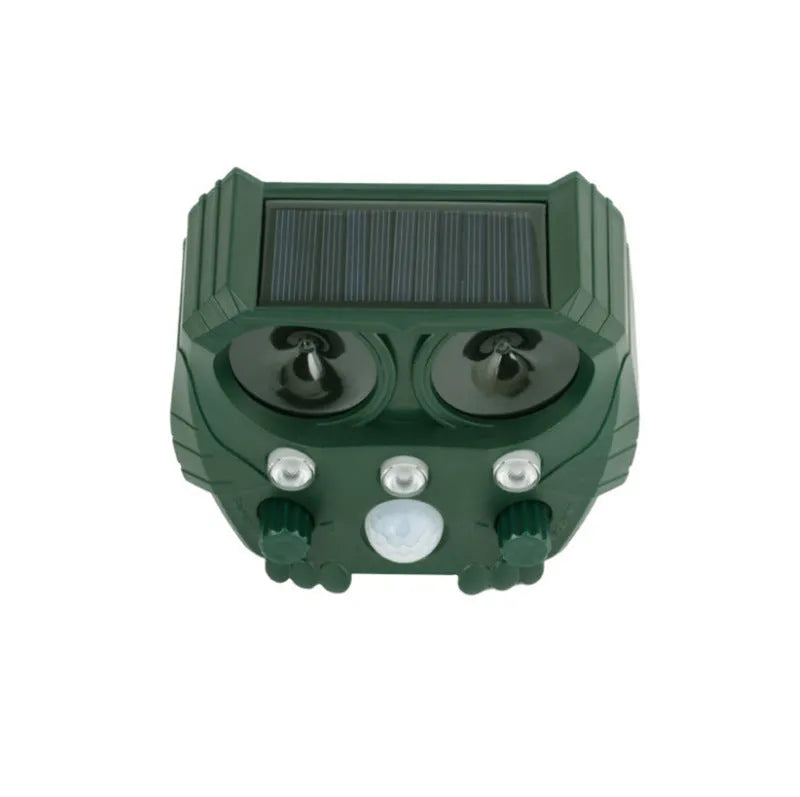 Green solar ultrasonic animal repeller with solar panel on top for outdoor pest control