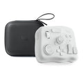 TourBox NEO black USB video editing controller and auxiliary keyboard on a desk