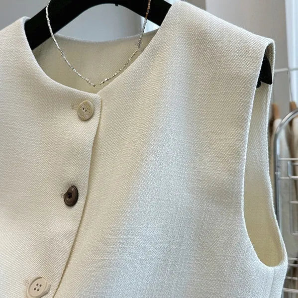 Women's round neck sleeveless vest in a fitted bandage dress style, shown in milky white.
