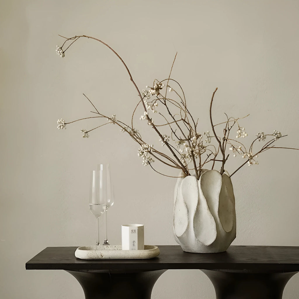 Irregular shaped art ceramic vase for flower arrangements in low and high style options.