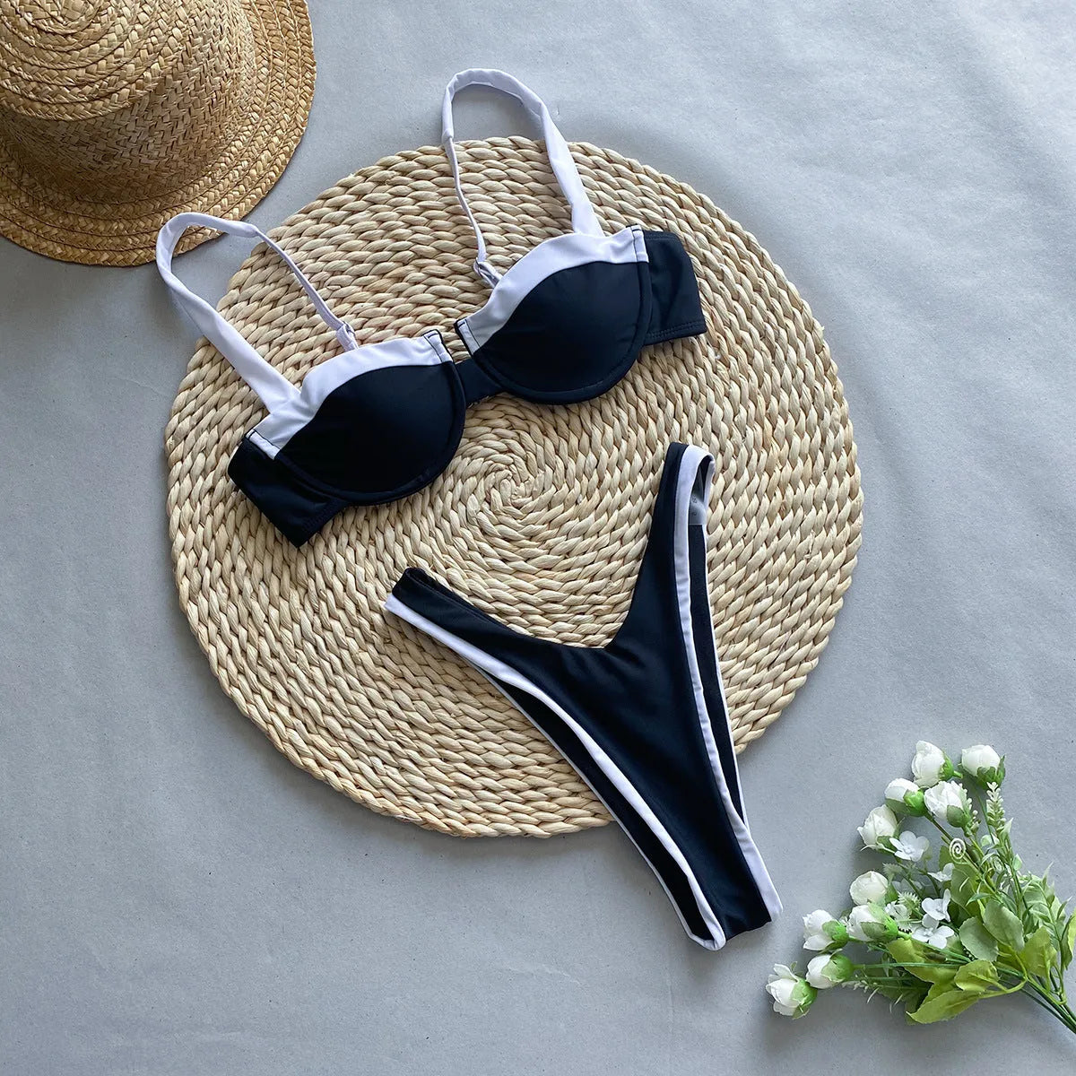 Black women's bikini briefs with stitching detail, nylon fabric, sizes S M L.