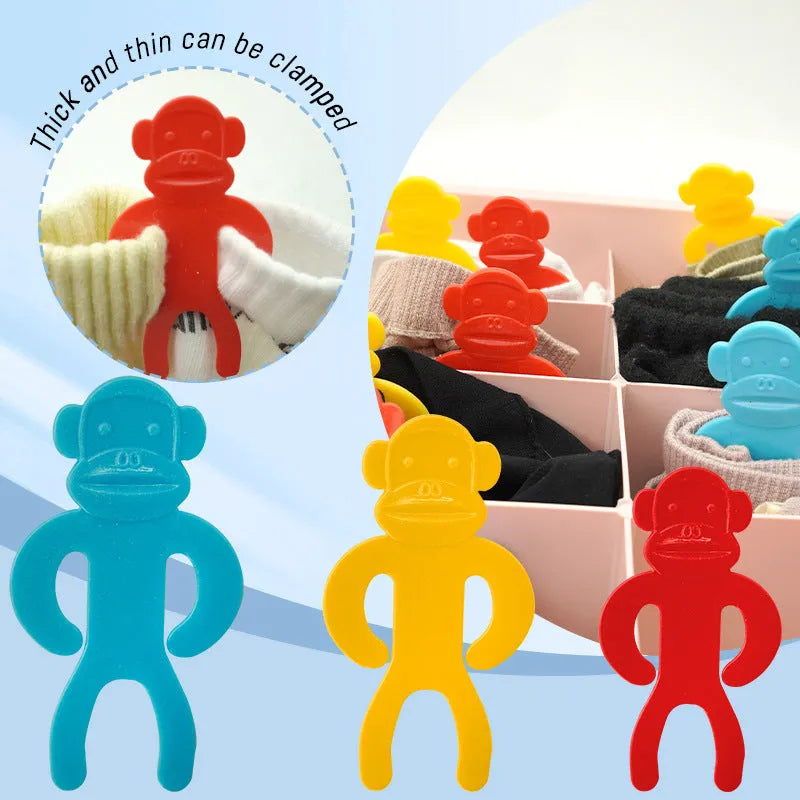 Plastic socks storage clips in blue, yellow and red colours for laundry organisation