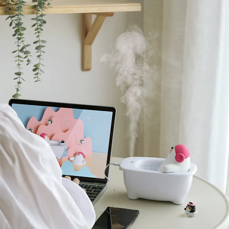White USB air humidifier and aromatherapy scent diffuser with 550ml water tank on desk