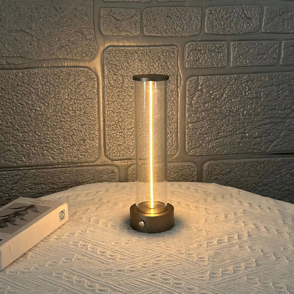 Slim warm white LED light strip with magnetic base for USB charging and attachment to metal surfaces.