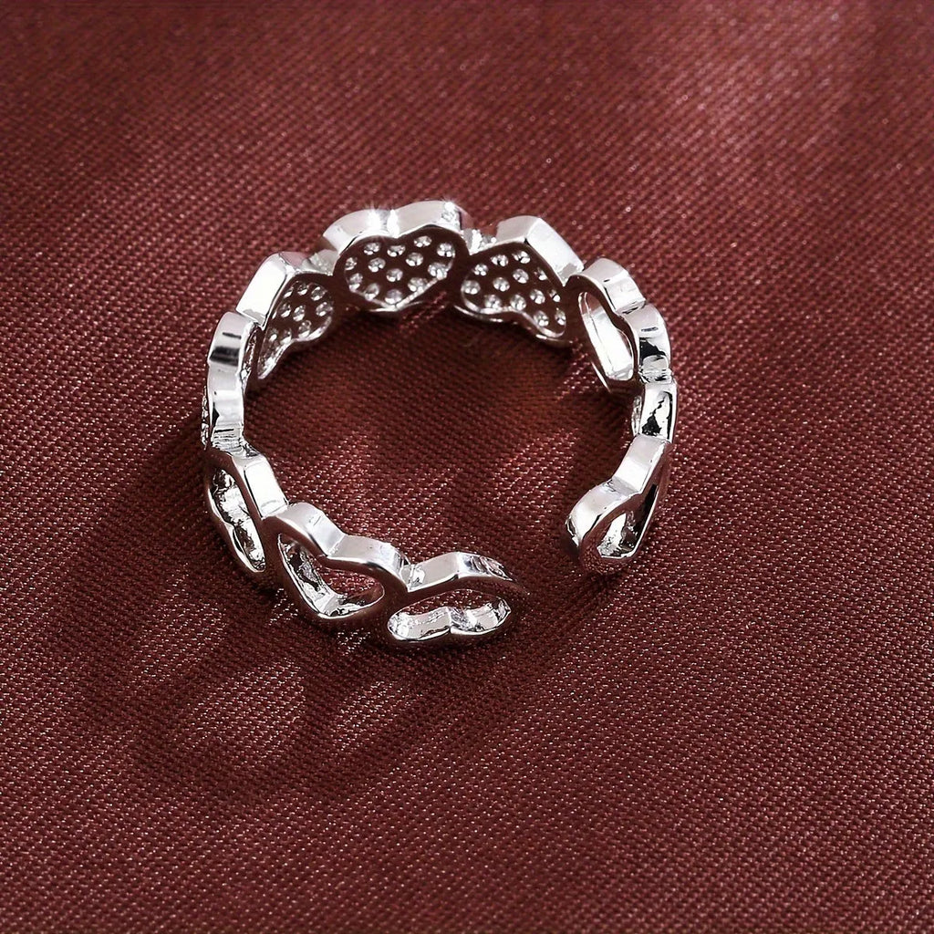 Adjustable couples opening ring with geometric heart design in gold and silver colour options