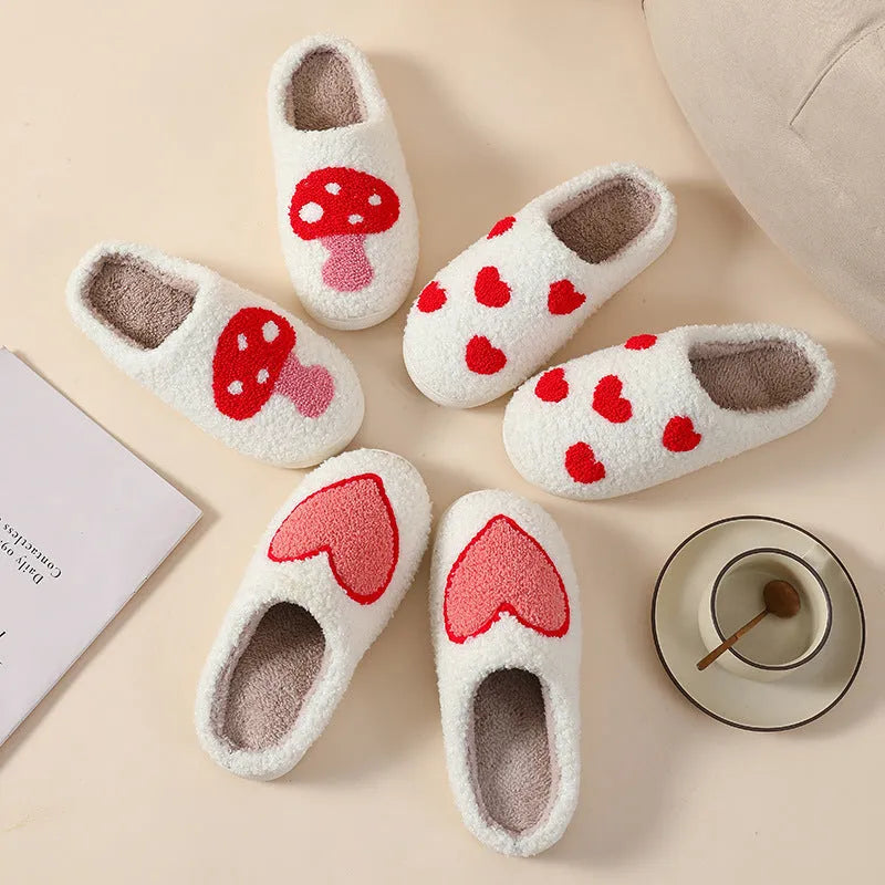 Women's plush cartoon love style home slippers in multiple colours with a non-slip PVC sole.