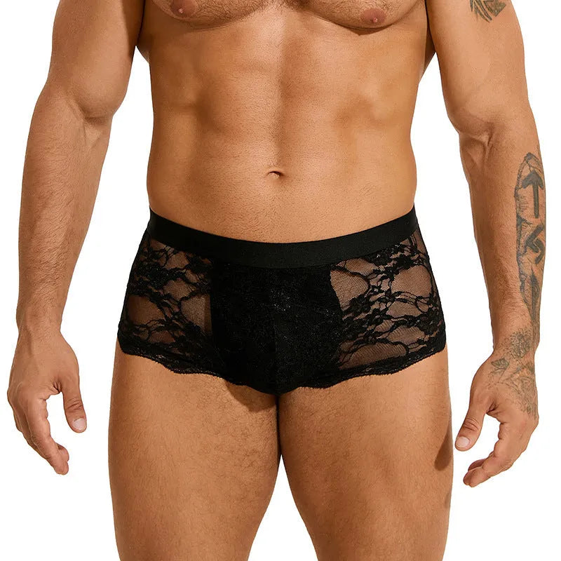 Men's black lace briefs with hollow-out see-through design on white background