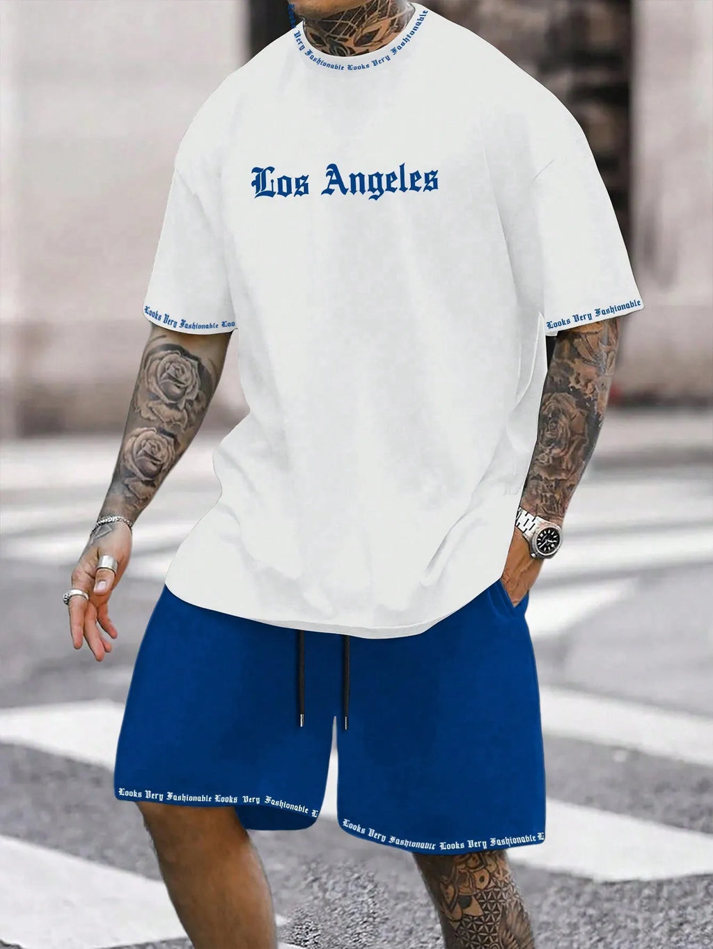 Man wearing a blue printed short-sleeve top and matching shorts from a quick-dry sports set.