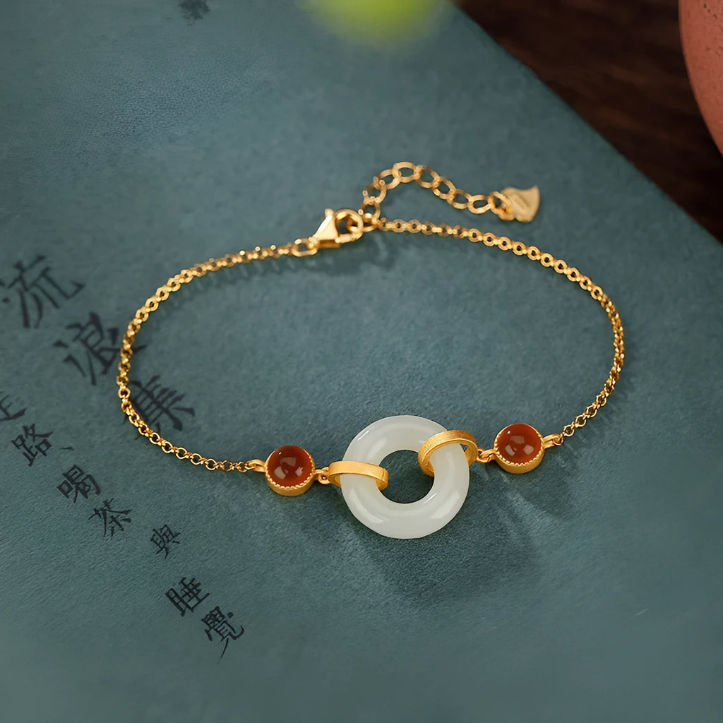 Gold-plated sterling silver bracelet with natural Hetian jade stone and peace buckle closure