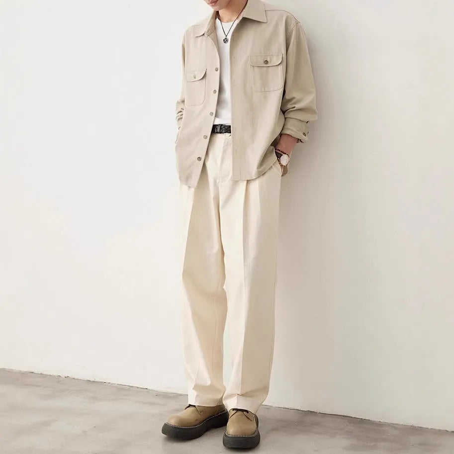 Men's light sand rice cotton lapel long sleeve shirt on a hanger.