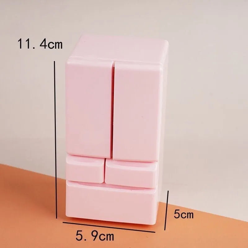 White plastic miniature candy shop toy model with illuminated interior window.