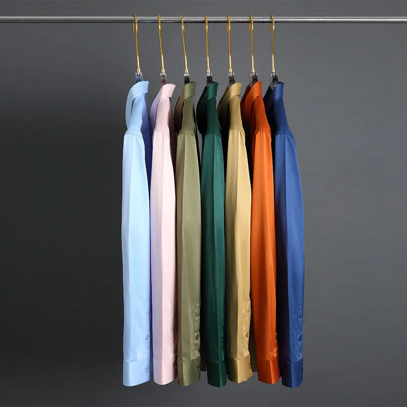 Man wearing a solid colour long-sleeved non-ironing shirt made from elastic polyester spandex fabric.