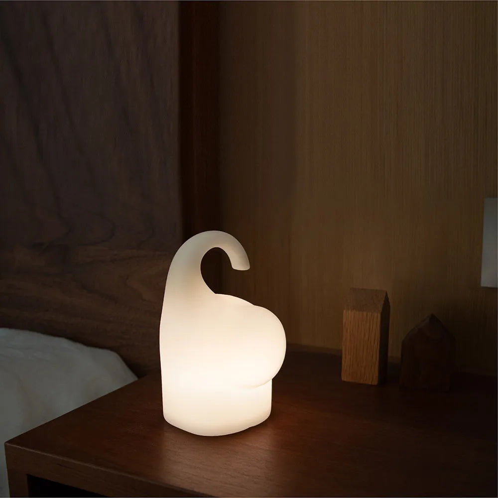DOMI Elephant-shaped silicone and plastic night light with warm white glow.