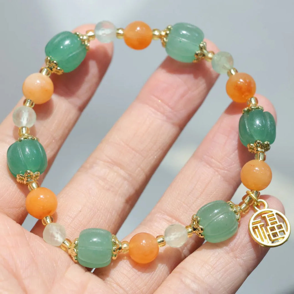 Duobao pumpkin bracelet for women with Jinsi Jade barrel beads and hanging charm on 14-16.5cm wrist
