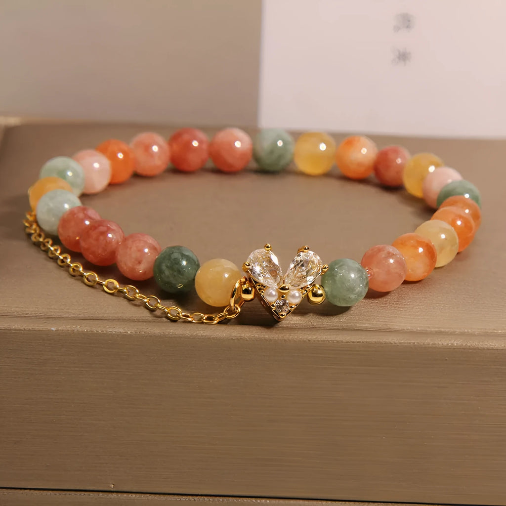 Fu Lu Shou crystal bracelet for women with gold tone metal settings and V-shaped zircon design