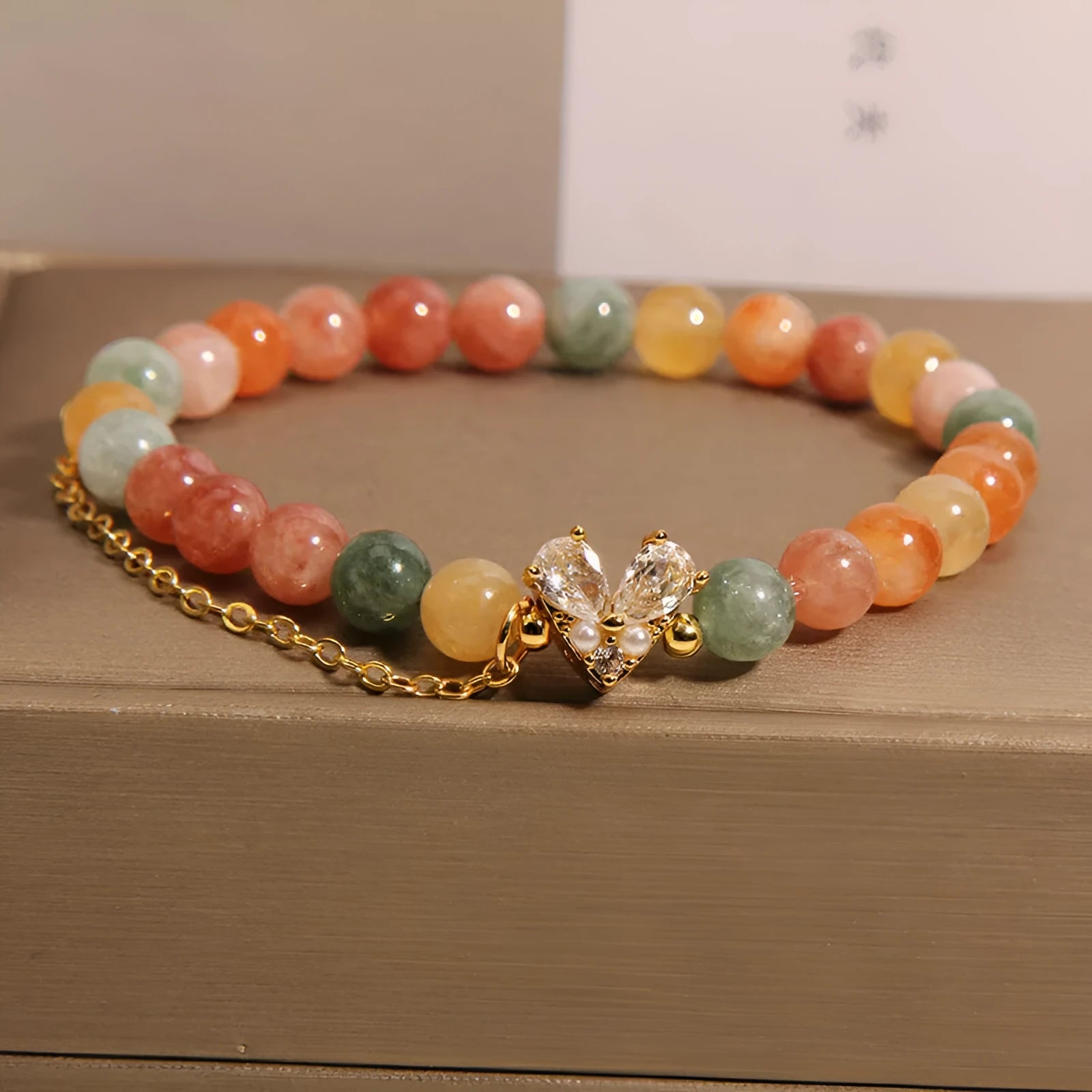 Fu Lu Shou crystal bracelet for women with gold tone metal settings and V-shaped zircon design