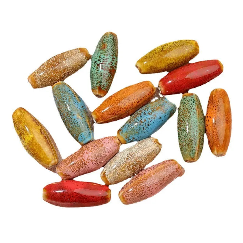Assortment of ceramic bullet beads in flower glaze colours for jewellery making