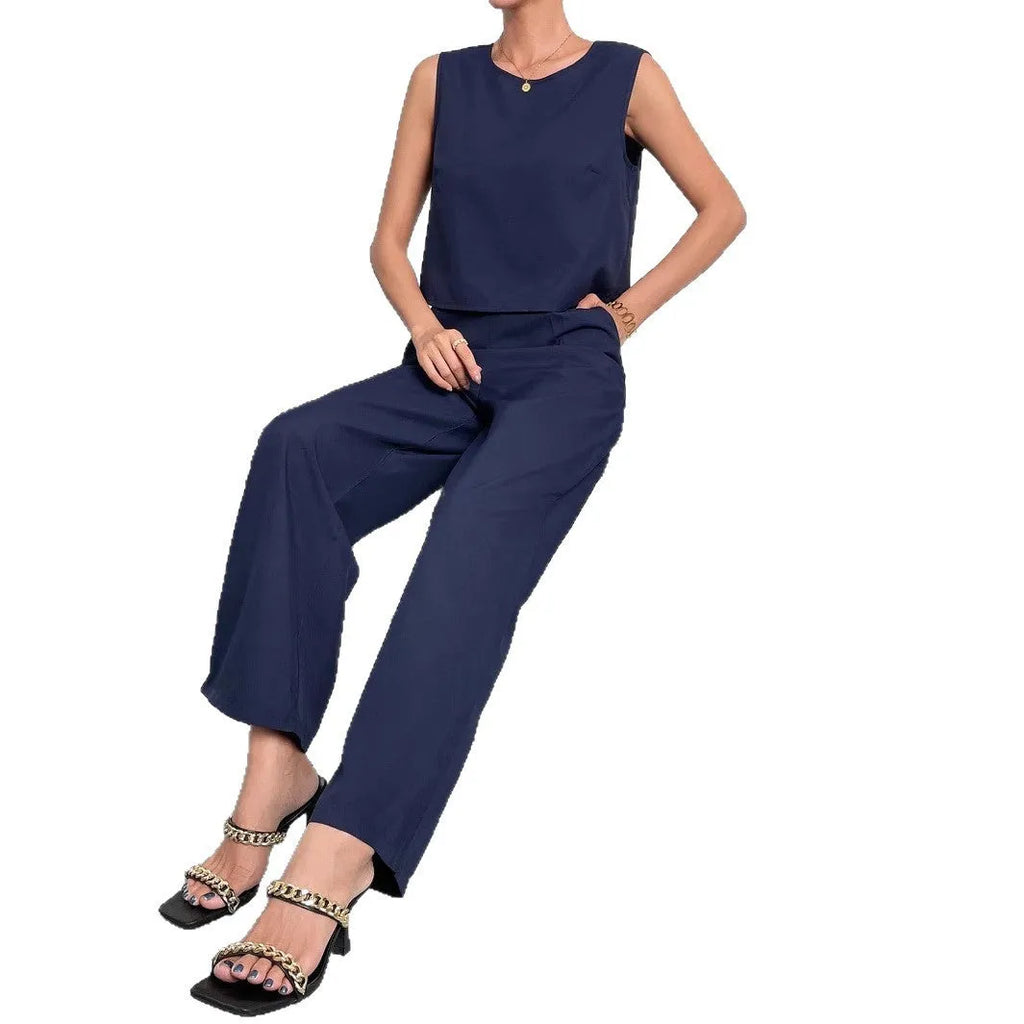 Red sleeveless top and wide leg trouser two-piece set laid flat, showing Asian sizing label.