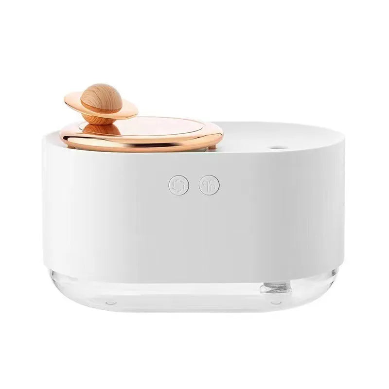 Green rotating planet-shaped USB humidifier with night light on a wooden surface