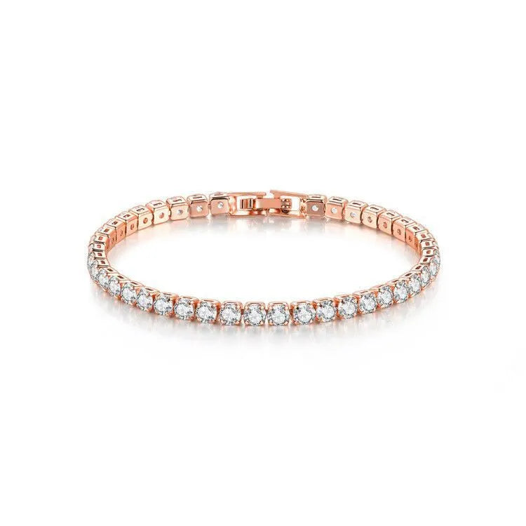 Stainless steel zircon bracelet single row 4mm round full diamond tennis chain in gold finish on white background