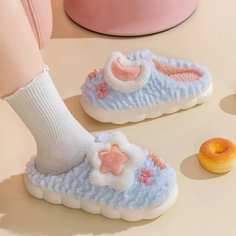 Light blue cartoon animal pattern women's fleece-lined slippers with round toe and PVC sole.