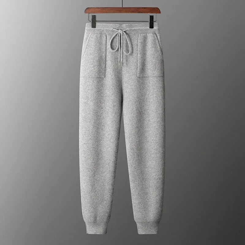 Men's light grey cashmere-blend hooded sweatshirt and matching joggers laid flat.