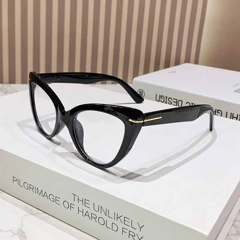 Women's large cat's eye frame glasses with dragon and phoenix decorations, shown in various colour options.