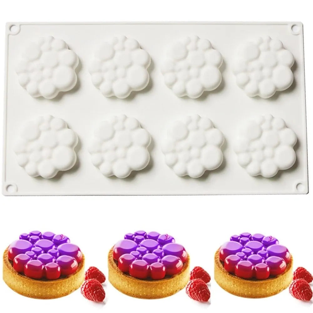Round silicone baking mould with eight raised bubble cavities for tower cakes.