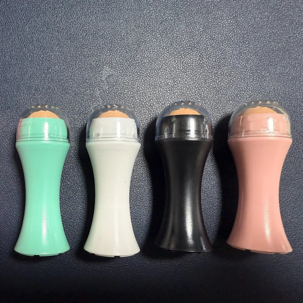 Volcanic stone portable reusable face roller for oily skin control in black, green, pink, or white.