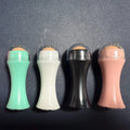 Volcanic stone portable reusable face roller for oily skin control in black, green, pink, or white.