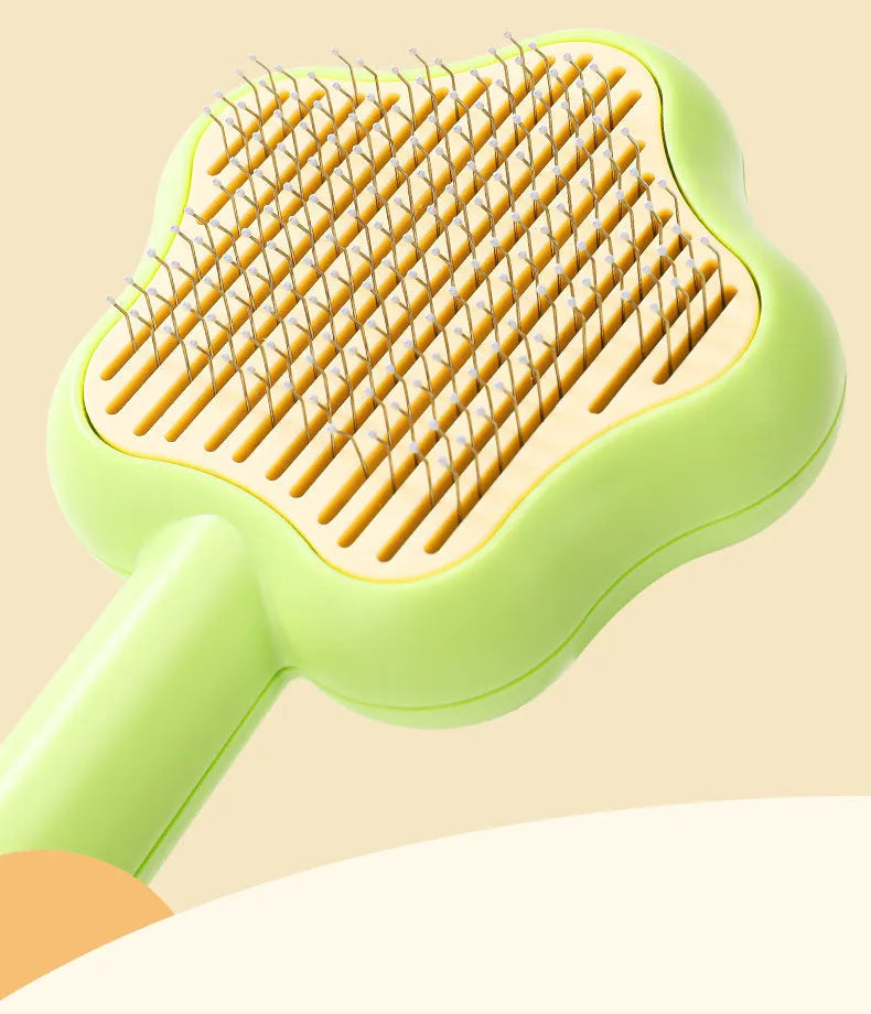 Green or yellow self-cleaning stainless steel cat comb measuring 20cm long
