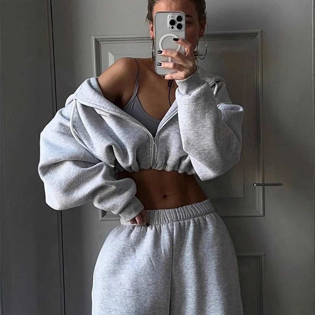 Long sleeve polyester sports sweater suit two-piece set in light grey, showing coat and trousers.