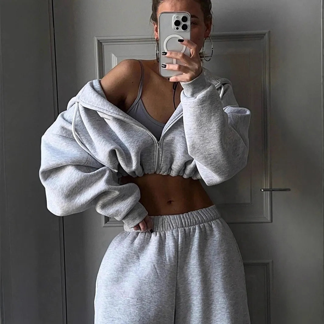 Long sleeve polyester sports sweater suit two-piece set in light grey, showing coat and trousers.