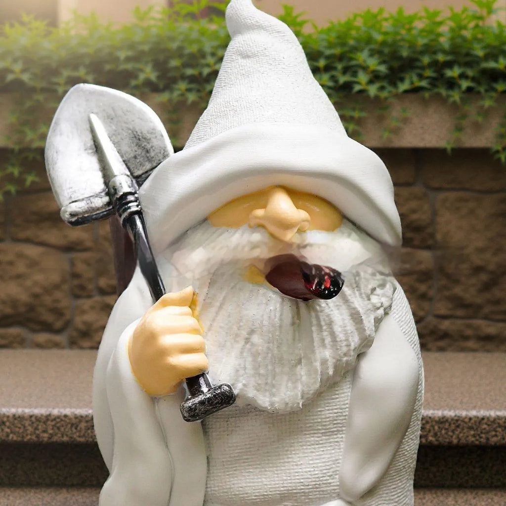 Christmas resin ornament of a dwarf holding a smoking shovel for garden and table decoration