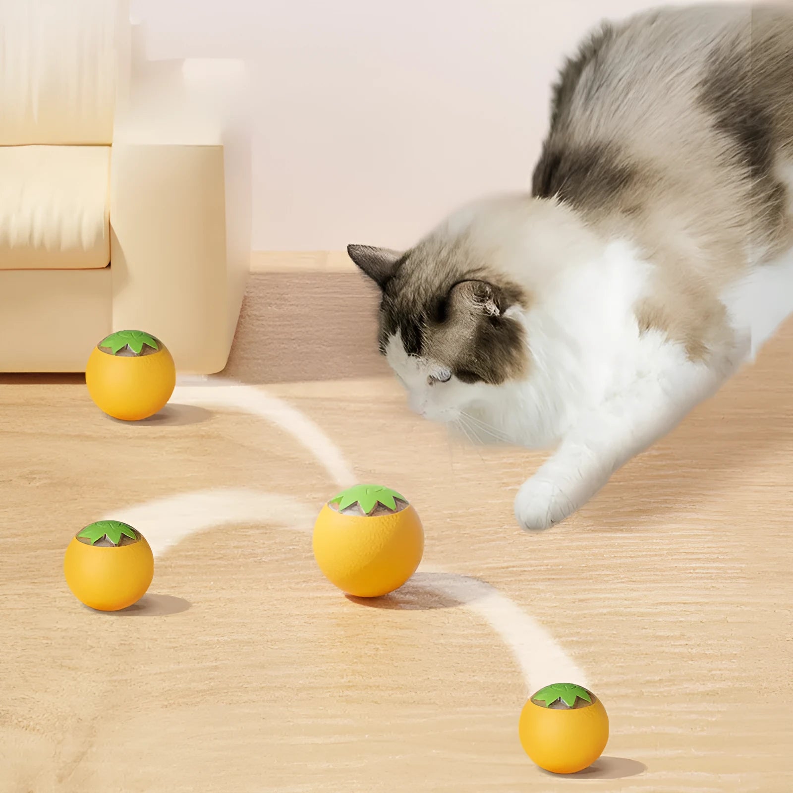 Small green automatic rolling ball toy for dogs and cats on a wooden floor.